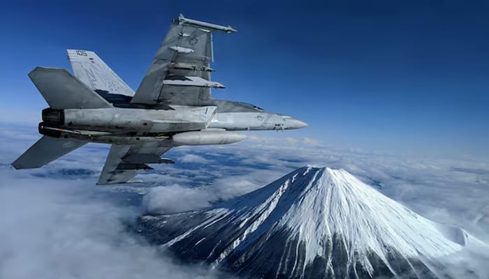 A US Navy F/A-18F Super Hornet flies past Mount Fuji, Japan. via US Navy/Lt. Alex Grammar Purchase Licensing Rights — Reuters
