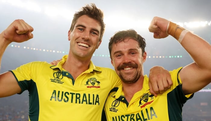 Australias Pat Cummins and Travis Head celebrate after winning the ICC Mens Cricket World Cup 2023 final against India at Narendra Modi Stadium, Ahmedabad on November 19, 2023. — ICC