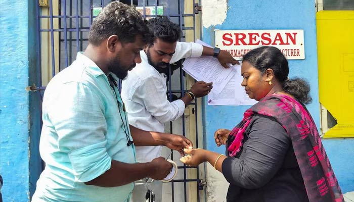 A state health official sticks a notice outside the Sresan Pharmaceutical factory whose Coldrif cough syrup has been linked to the deaths of 17 children in Madhya Pradesh, in Chennai, India, October 7, 2025. — Reuters