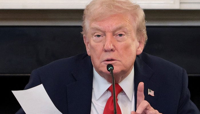US President Donald Trump holds a note that was handed to him by US Secretary of State Marco Rubio during a roundtable on antifa, an anti-fascist movement Trump designated a domestic terrorist organisation via executive order on September 22, at the White House in Washington, D.C., US, October 8, 2025. — Reuters