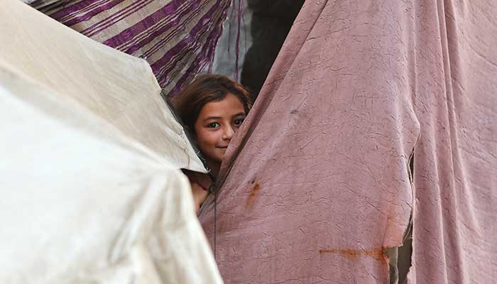 A Palestinian girl reacts while sheltering at a tent, after US President Donald Trump announced that Israel and Hamas agreed on the first phase of a Gaza ceasefire, in Khan Younis, Gaza on October 9, 2025. — Reuters