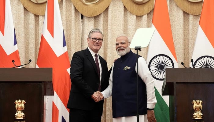 British Prime Minister Sir Keir Starmer and the Prime Minister of India, Narendra Modi, shake hands after delivering a statement to the press at Raj Bhavan, in Mumbai, India on October 9, 2025. — Reuters