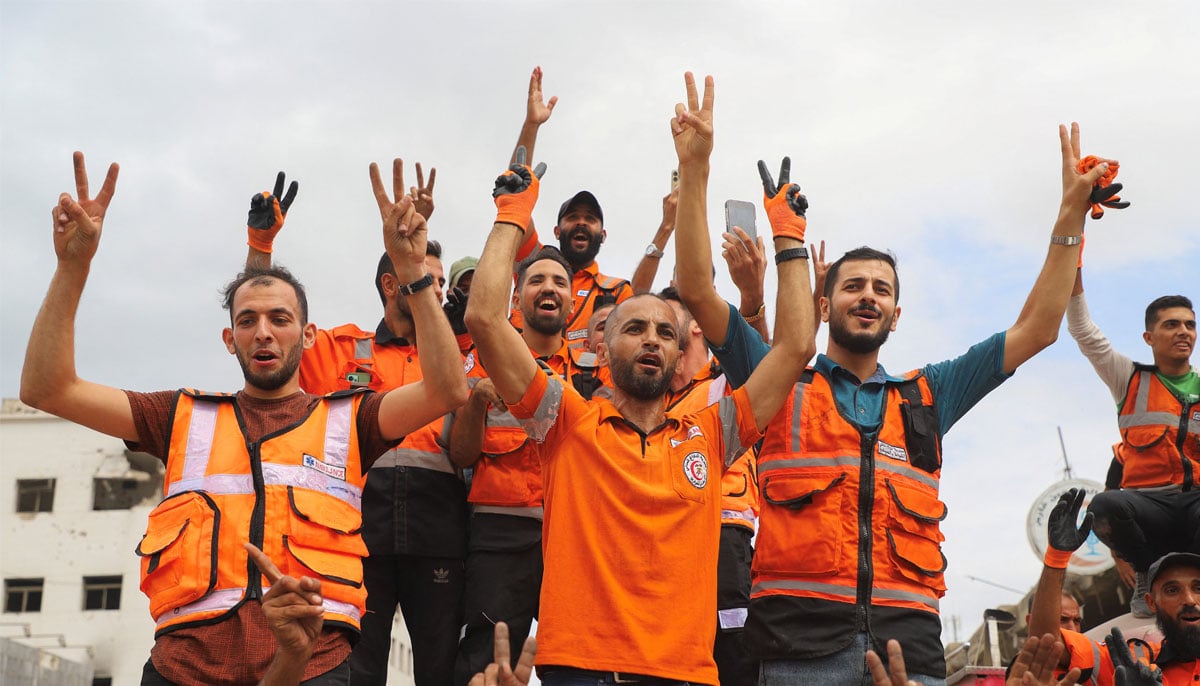Palestinian emergency personnel celebrate, after US President Donald Trump announced that Israel and Hamas agreed on the first phase of a Gaza ceasefire, in Gaza City, October 9, 2025.— Reuters