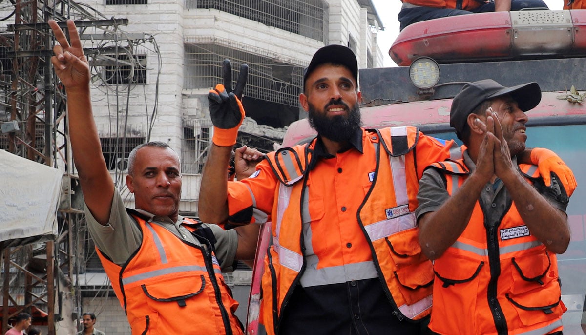 Palestinian emergency personnel celebrate, after US President Donald Trump announced that Israel and Hamas agreed on the first phase of a Gaza ceasefire, in Gaza City, October 9, 2025.— Reuters