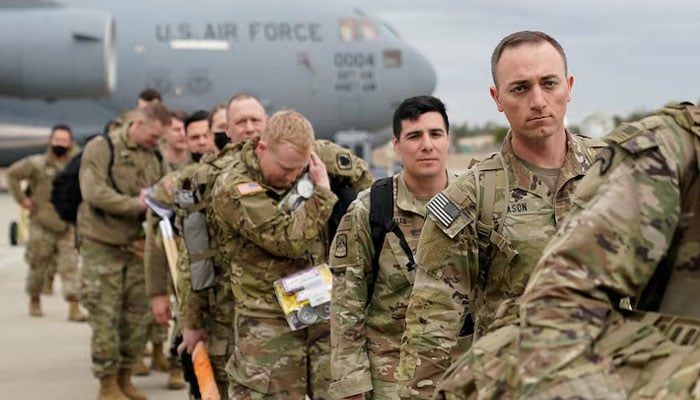 Military personnel from the 82nd Airborne Division and 18th Airborne Corps board a C-17 transport plane for deployment to Eastern Europe, amid escalating tensions between Ukraine and Russia, at Fort Bragg, North Carolina, US, February 3, 2022. — Reuters