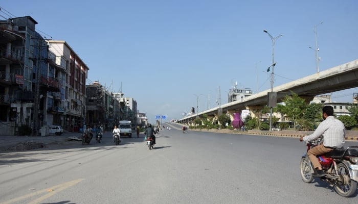 A view of deserted Muree road and Metro bus track in Rawalpindi due to TLP protest. — Online