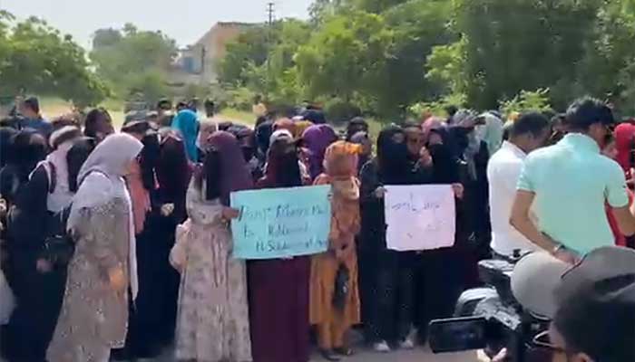 University of Karachi students protest following Aniqa Saeeds death in tragic campus bus accident. — Reporter