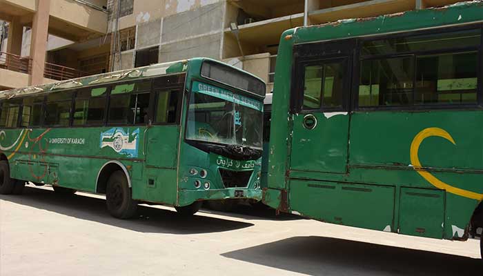 This file photo shows University of Karachi campus buses parked in the varsity premises. — Facebook/@kutimes