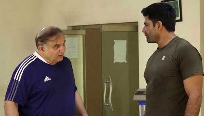 This file photo shows ace javelin thrower Arshad Nadeem (right) and his coach Salman Iqbal Butt. — Reporter
