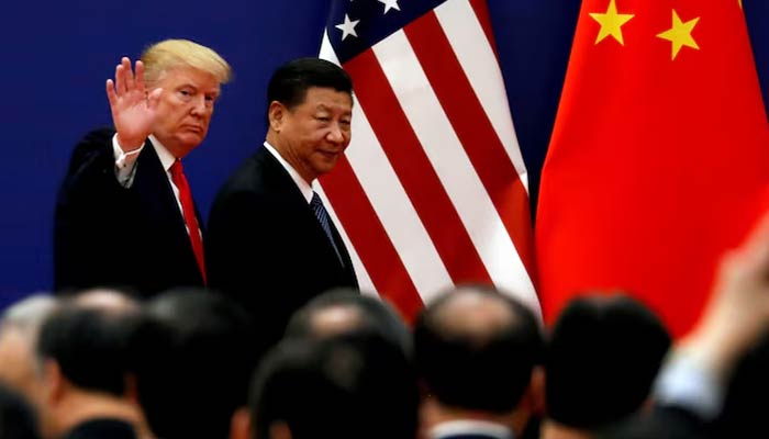 US President Donald Trump with Chinese counterpart Xi Jinping in Beijing in November 2017, during his first term as leader of the United States. — AFP