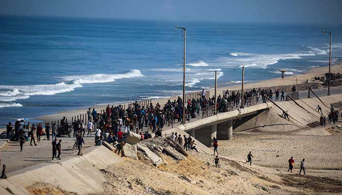 Palestinians gather on a street in Nuseirat in the central Gaza Strip on October 10, 2025. — AFP
