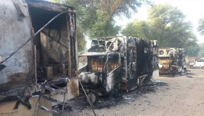Charred vehicles seen in the aftermath of DI Khan police training centre attack in this still captured on October 11, 2025. — Reporter
