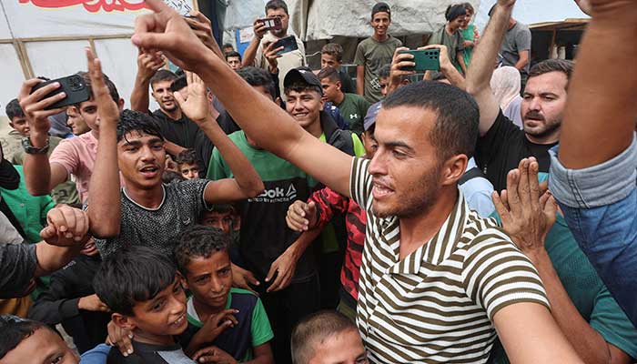Palestinians celebrate after it was announced that Israel and Hamas agreed on the first phase of a Gaza ceasefire, in Khan Younis in the southern Gaza Strip, October 9, 2025. — Reuters
