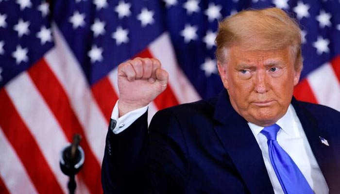 US President Donald Trump raises his fist as he reacts to early results from the 2020 presidential election in the East Room of the White House in Washington on November 4, 2020. — Reuters