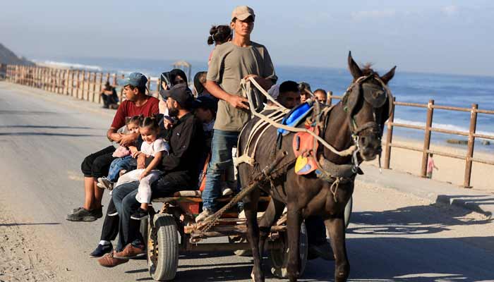 Palestinians, who were displaced to the southern part of Gaza at Israels order during the war, make their way along a road, on an animal-drawn cart, as they return to the north, amid a ceasefire between Israel and Hamas in Gaza, in the central Gaza Strip, October 11, 2025. — Reuters
