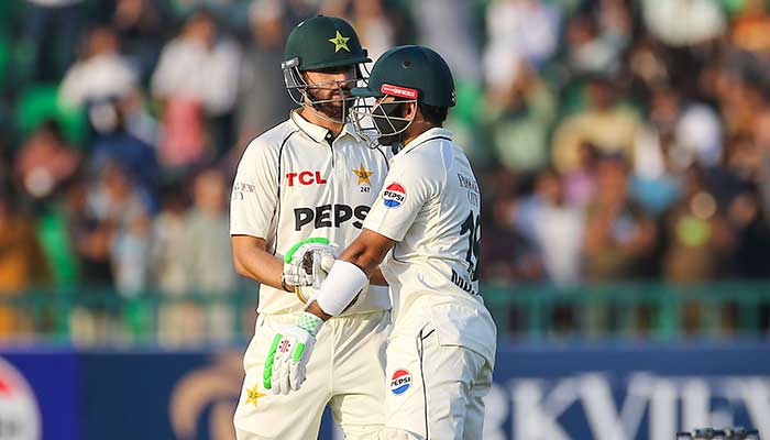 Salman Agha (left) and Mohammad Rizwan fist-bumping during the day 1 of first Test match against South Africa at Gaddafi Stadium, Lahore, on October 12, 2025. — PCB