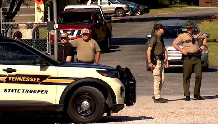 Law enforcement officers guard a gate outside the Accurate Energetic Systems military explosives plant, after an explosion at the facility in Bucksnort, Tennessee, US October 10, 2025. — Reuters