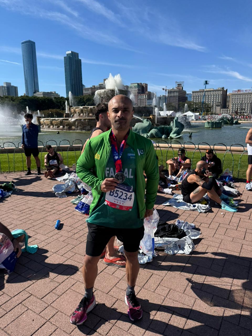 Karachi-based Pakistani marathon runner Faisal Shafi shows off his medal after finishing the Chicago Marathon with distinction. — Reporter
