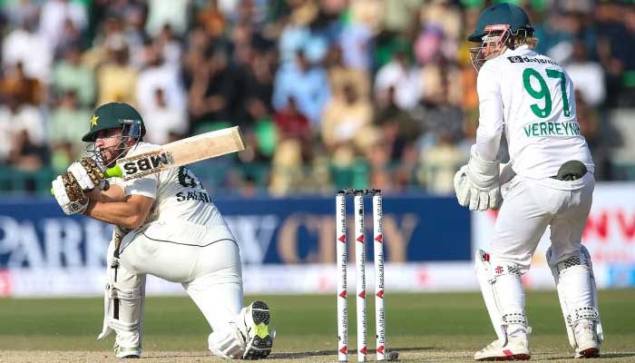 Pakistan middle-order batter Salman Ali Agha (left) plays a shot during the first Test against South Africa at the Gaddafi Stadium in Lahore on October 12, 2025. – PCB