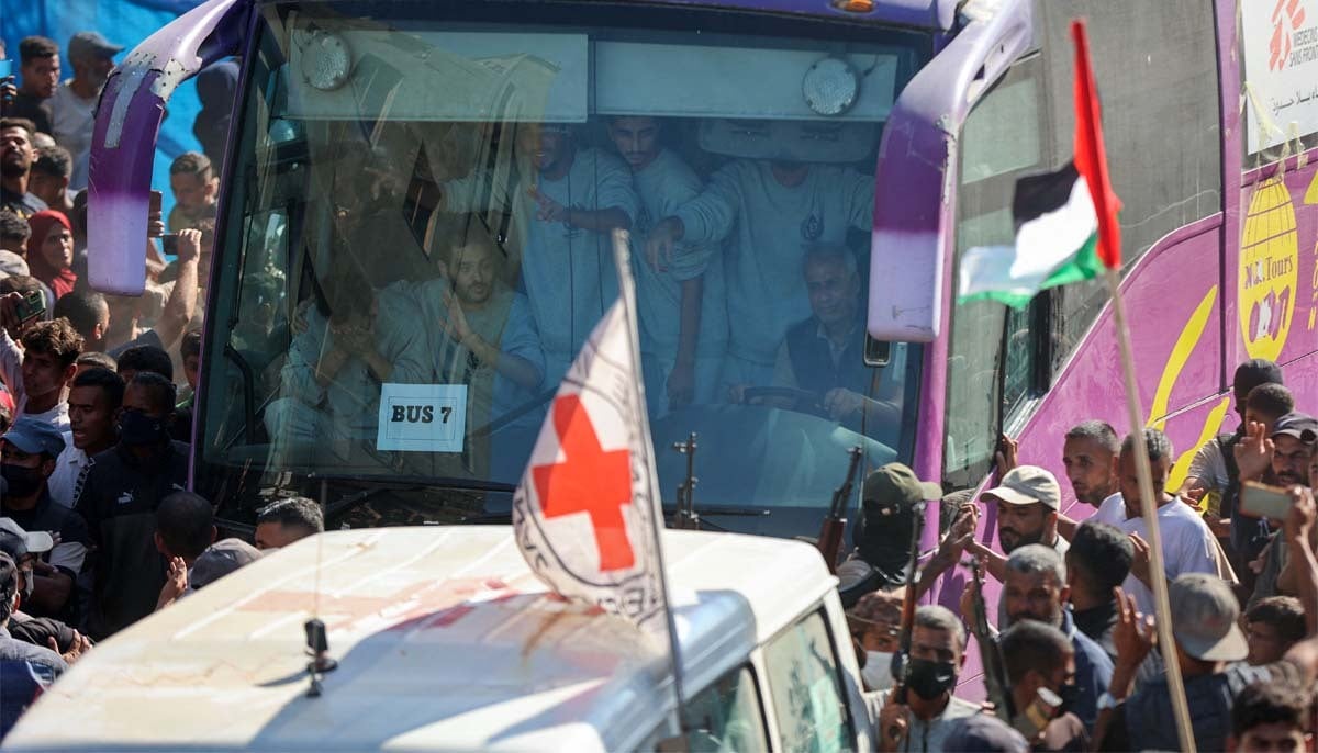 Buses carrying Palestinian prisoners released by Israel on Monday under a Gaza ceasefire, arrive outside the Nasser hospital in Khan Yunis in the southern Gaza Strip on October 13, 2025.— AFP