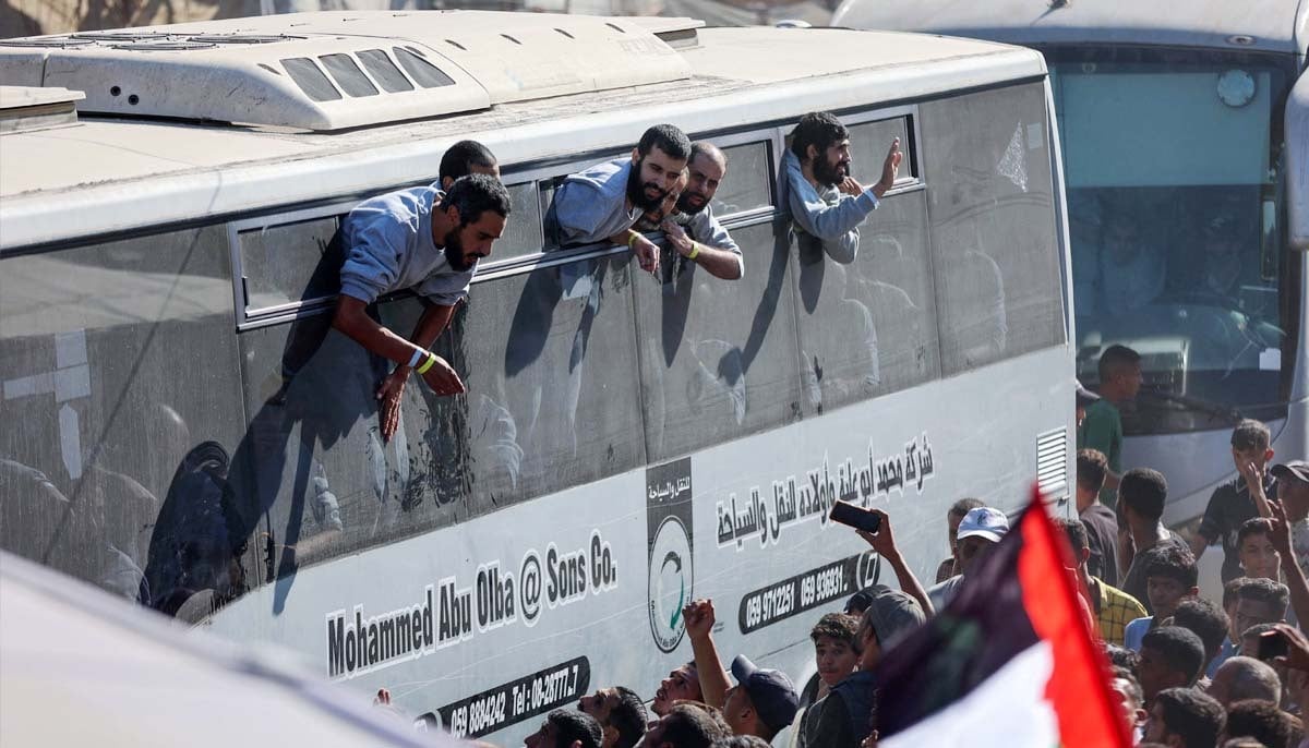 Buses carrying Palestinian prisoners released by Israel on Monday under a Gaza ceasefire, arrive outside the Nasser hospital in Khan Yunis in the southern Gaza Strip on October 13, 2025.— AFP