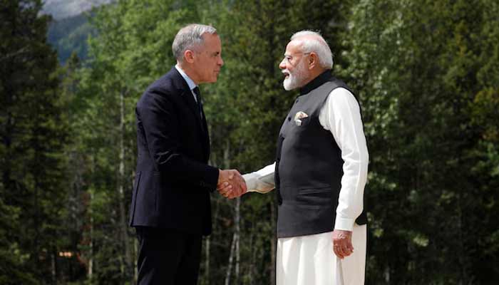 Canadian Prime Minister Mark Carney and Indias Prime Minister Narendra Modi shake hands before posing for a photo during the G7 Leaders Summit in Kananaskis, in Alberta, Canada, June 17, 2025.— Reuters