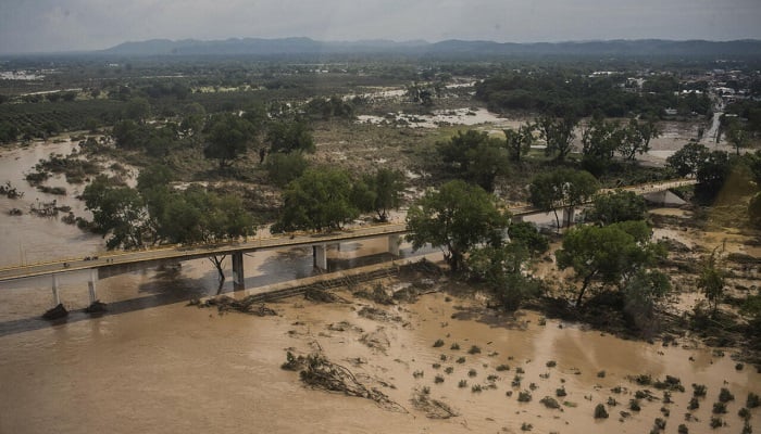 Floodwaters engulf open land dotted with trees in Veracruz, one of the hardest-hit states after days of heavy rain and severe flooding. —AFP