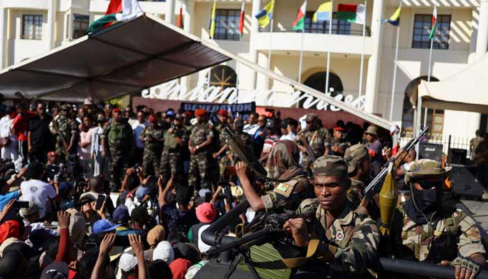 Colonel Michael Randrianirina speaks on stage after joining protesters gathered outside the town hall on Independence Avenue during a nationwide youth-led demonstration against frequent power outages and water shortages, in Antananarivo, Madagascar, October 14, 2025.