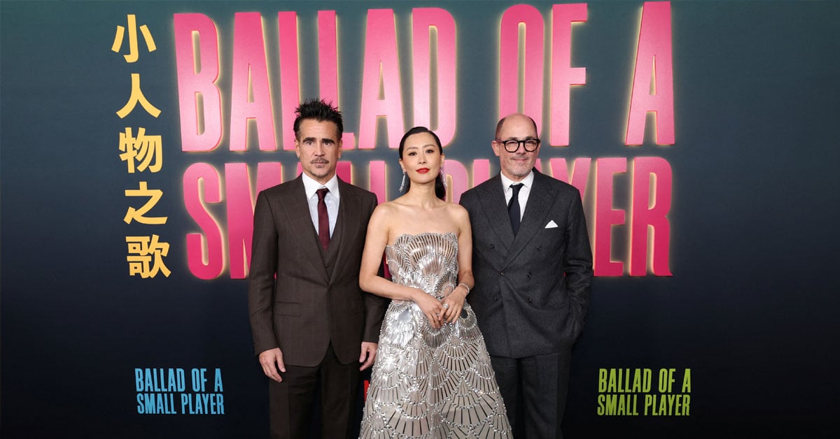 Colin Farrell and Fala Chen pose with director Edward Berger as they attend the premiere of Ballad of a Small Player at The Egyptian Theatre Hollywood in Los Angeles, California, U.S., October 14, 2025. REUTERS/Mario Anzuoni