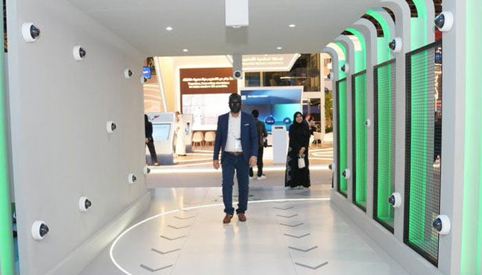 This undated image shows a person walks through ‘Biometric Tunnel’ in Dubai. — reporter