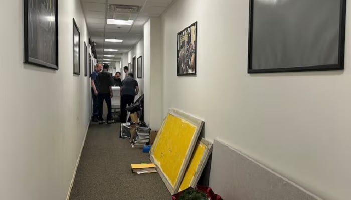 Members of a news media crew take down journalists’ workspaces after at least 30 news organisations declined to sign a new Pentagon access policy for journalists, at the Pentagon in Washington, DC, US, October 15, 2025. — Reuters