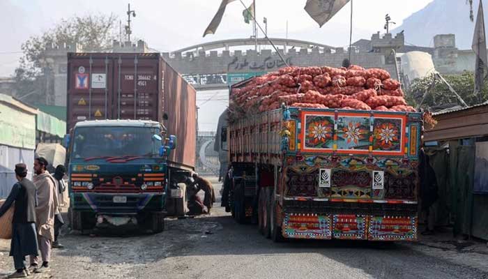 Trucks carrying goods pass through the zero-point Torkham border crossing with Afghanistan. — APF/File