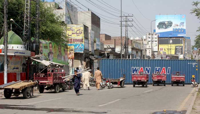 Containers used for closed roads as security has been high alert during protest demonstration of Tehreek-e-Labbaik Pakistan (TLP) at Multan road in Lahore on Thursday, October 16, 2025.  — PPI