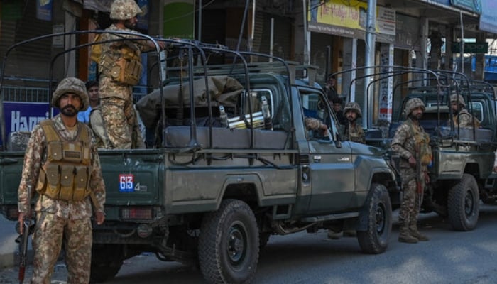 Pakistan Army troops stand guard along a street in Kabal town of Swat Valley in Khyber Pakhtunkhwa. AFP/File