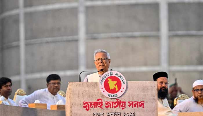 Muhammad Yunus (centre), Chief Adviser of Bangladeshs Interim Government and Head of the National Consensus Commission, speaks after signing the July National Charter at the South Plaza of the National Parliament in Dhaka on October 17, 2025. — AFP