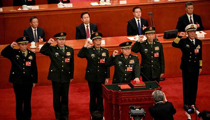 Zhang Youxia (front), Vice Chairman of the Central Military Commission of the Peoples Republic of China, swears an oath with members of the Central Military Commission (left) Zhang Shengmin, Liu Zhenli, He Weidong, Li Shangfu, and Miao Hua, after they were elected on March 11, 2023.— Reuters