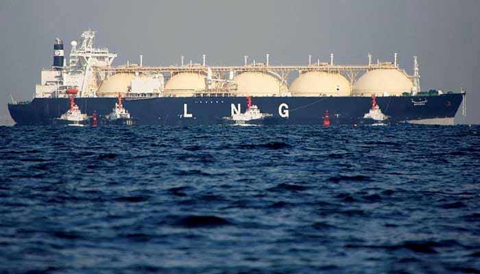 A liquefied natural gas (LNG) tanker is tugged towards a thermal power station in Futtsu, east of Tokyo, Japan on November 13, 2017. — Reuters