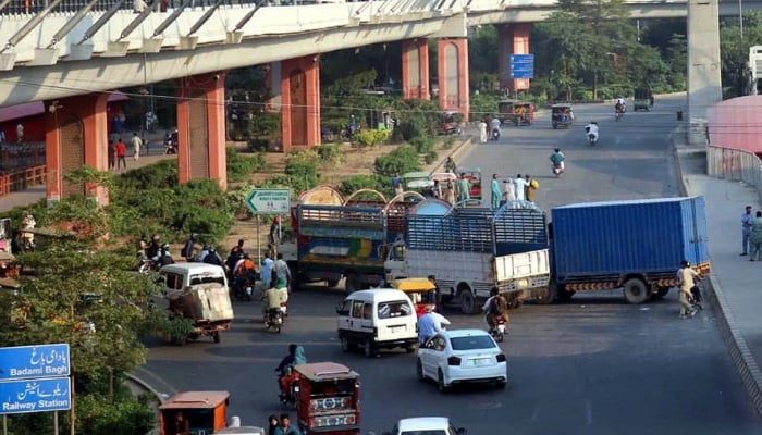 Containers are placed to block roads around Data Darbar ahead of Tehreek-e-Labbaik (TLP) protest in Lahore, October 17, 2025. — PPI