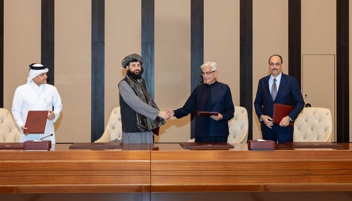 Defence Minister Khawaja Asif shakes hands with his Afghan counterpart Mullah Yaqoob after reaching a ceasefire deal with the Taliban regime in Doha, Qatar, on October 18, 2025. — X/@KhawajaMAsif