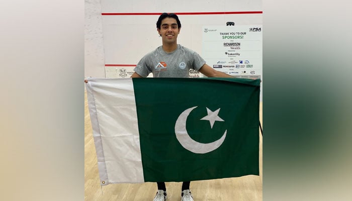 Pakistan squash player holding national flag poses for photograph after clinching Richardson Wealth Men’s Vancouver Open 2025 in Vancouver on October 20, 2025. — Reporter