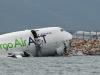 Cargo plane slides off runway in Hong Kong, killing two airport staff