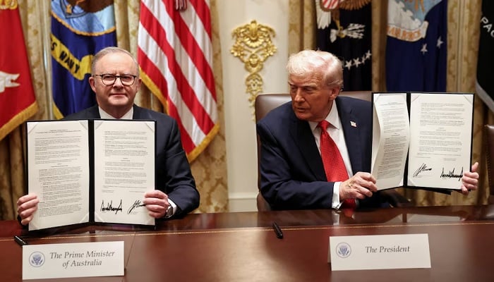 US President Donald Trump and Australias Prime Minister Anthony Albanese hold a signed agreement on rare earth and critical minerals during a meeting with in the Cabinet Room at the White House, in Washington, DC, US, October 20, 2025. — Reuters