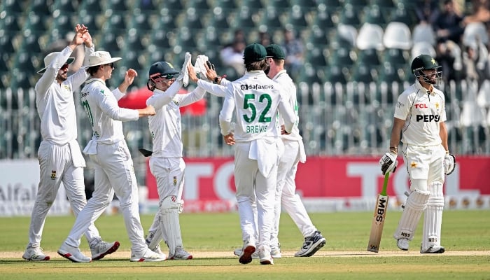 South Africas players celebrate after the dismissal of Pakistans Salman Agha (R) during the second day of the second Test cricket match between Pakistan and South Africa at the Rawalpindi Cricket Stadium in Rawalpindi on October 21, 2025. — AFP