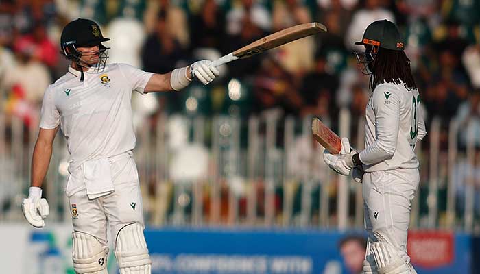 South Africas Tristan Stubbs raises his bat to celebrate half-century during day two of the second and final Test match against Pakistan at Rawalpindi Cricket Stadium on October 21, 2025. — PCB
