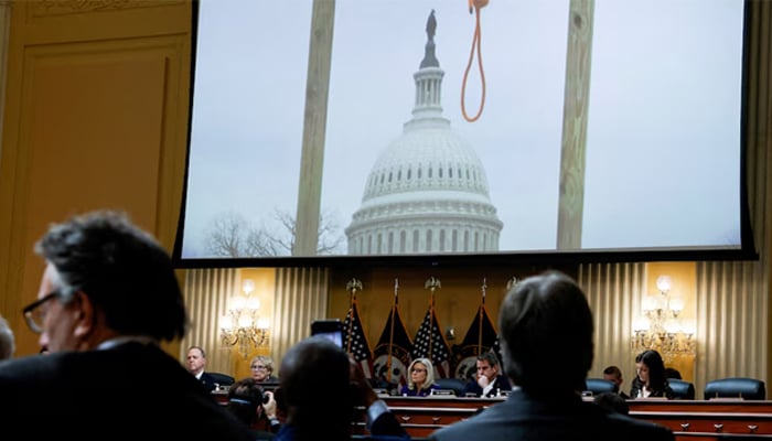 An image of a hangmans noose hanging from a gallows, that was set up outside the US Capitol building on January 6, 2021 by rioters, is displayed over the US House Select Committe. — Reuters