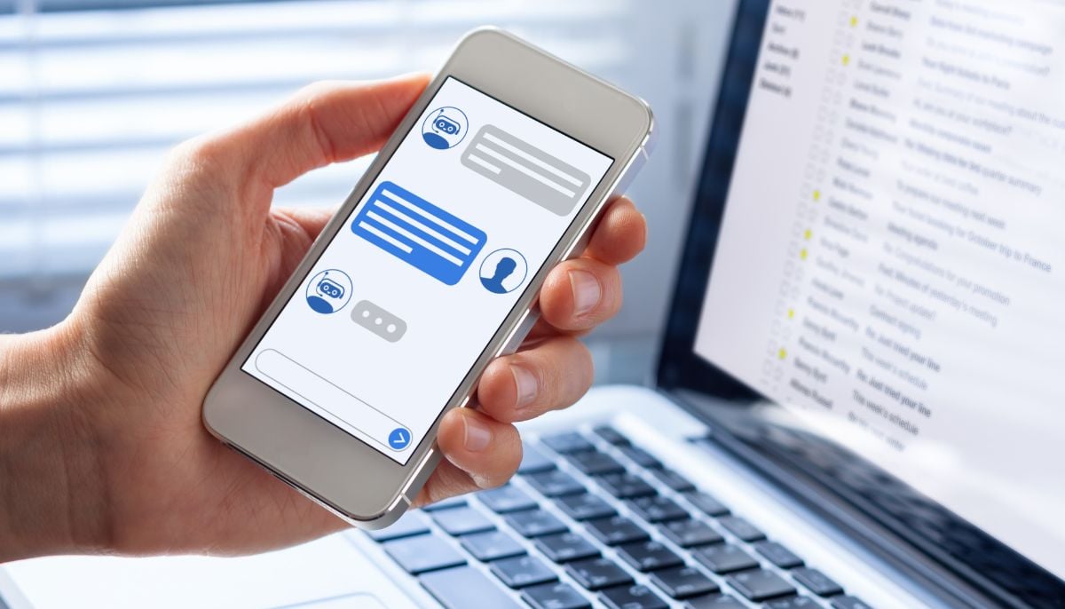 A representational image of a person using an AI chatbot on their smartphone. — Canva