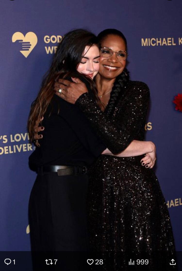 Anne Hathaway hugs Audra McDonald