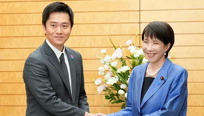 Japans new Prime Minister Sanae Takaichi shakes hands with Hirofumi Yoshimura, leader of the Japan Innovation Party, known as Ishin, during their meeting at the prime ministers official residence in Tokyo, Japan, October 21, 2025. — Reuters