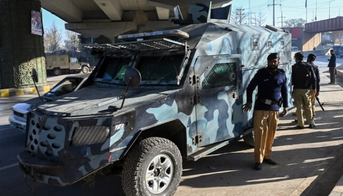Police stand guard in Peshawar, Khyber Pakhtunkhwa, February 9, 2024. — AFP