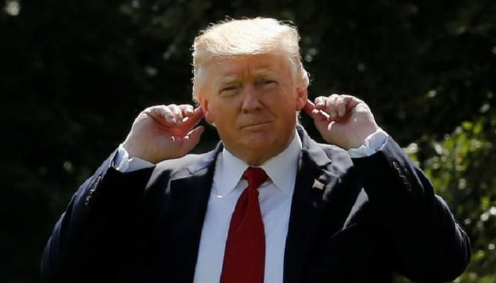 US President Donald Trump touches his ears in this undated photo. —Reuters/File